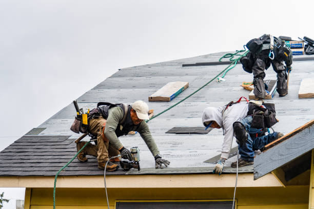 Professional Gutter Installation technician working in Sheldonville, MA